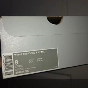 Nike Women’s White Air Force 1s Mid-Rise